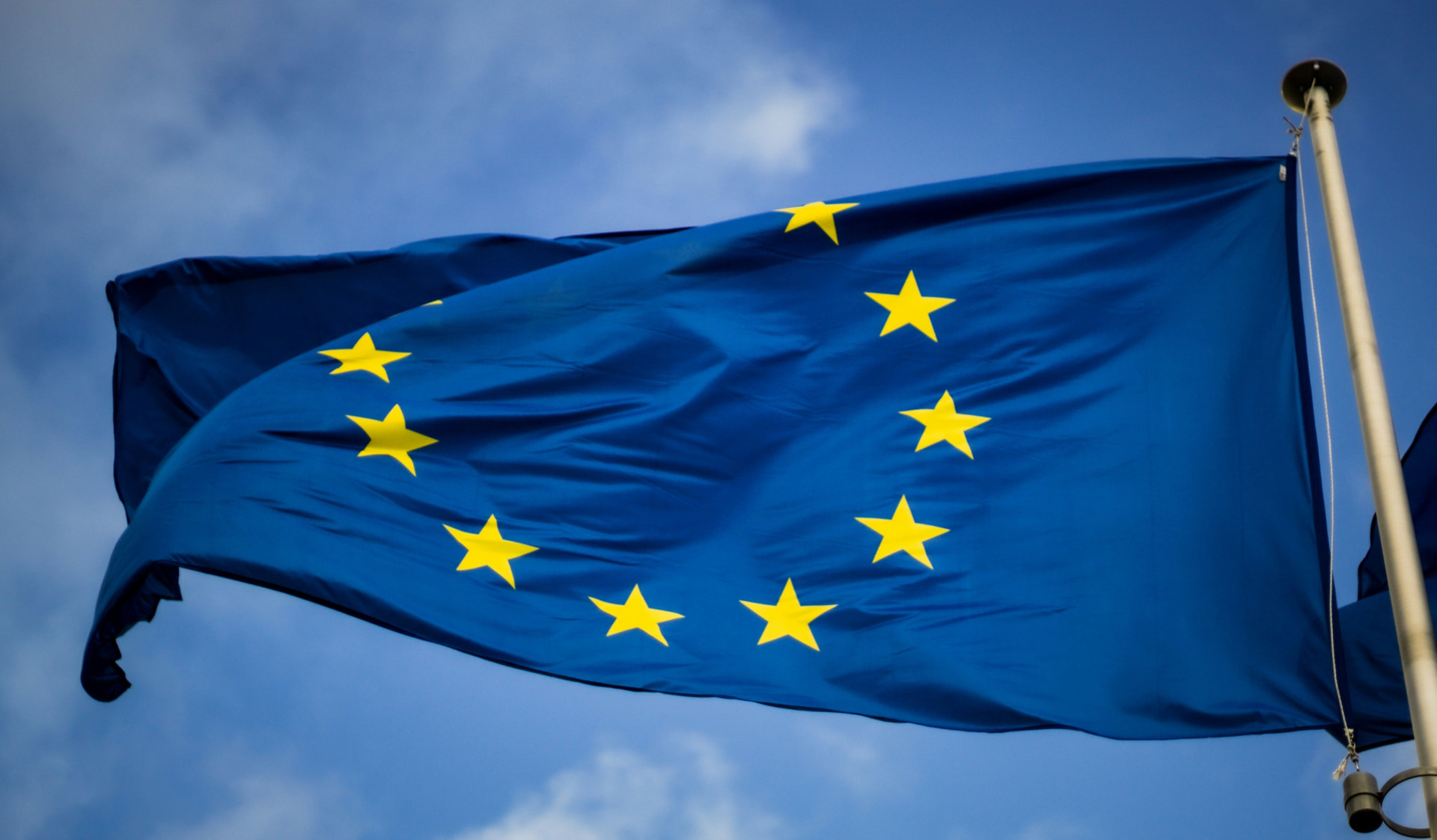 The European Union flag against a blue sky